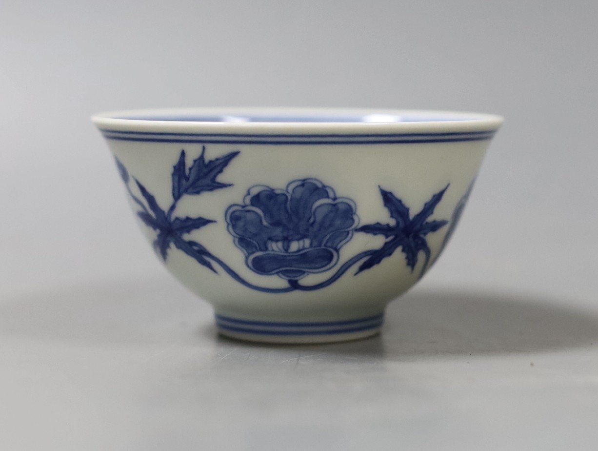 A Chinese blue and white circular bowl, inscription to base - 5cm tall